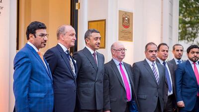 UAE and UK dignitaries pose for a photo.