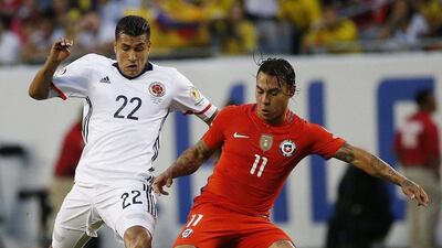 Colombia's Jeison Murillo (22) and Chile's Eduardo Vargas (11) vie for the ball during a Copa America Centenario semifinal soccer match at Soldier Field in Chicago, Wednesday, June 22, 2016. (AP Photo/Nam Y. Huh)
