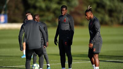 Kurt Zouma trains with Ross Barkley of Chelsea, left, and Michy Batshuayi, right. Getty