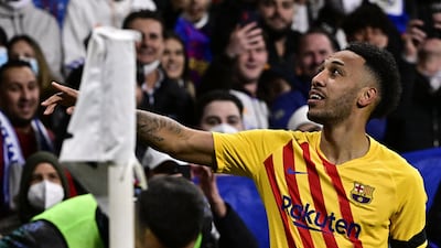 Pierre-Emerick Aubameyang points to the crowd after scoring for Barcelona against Real Madrid. AFP