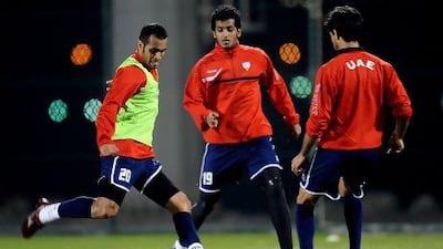 Saeed Al Kathiri, left, and Abdulaziz Sanqour, centre, take part in a training session ahead of today's match with Bahrain. Courtesy of the UAE FA