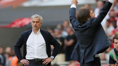 Manchester United manager Jose Mourinho, left, looks dejected as Antonio Conte celebrates Chelsea's 1-0 FA Cup final victory on Saturday. David Klein / Reuters