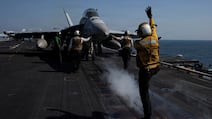 A US attack aircraft prepares to launch from the USS Abraham Lincoln in support of Operation Epic Fury. US Navy via Reuters.