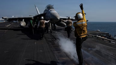 A US attack aircraft prepares to launch from the USS Abraham Lincoln in support of Operation Epic Fury. US Navy via Reuters.