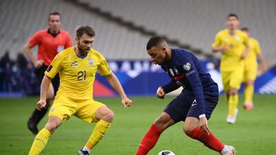 Kylian Mbappe is closed down by Ukraine midfielder Oleksandr Karavaev. AFP