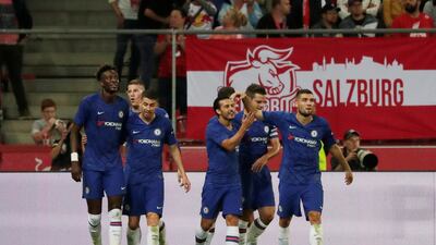 Chelsea's Pedro celebrates scoring the fourth goal with teammates. Reuters