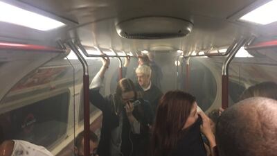 Smoke fills the carriage of a London Underground train on the Bakerloo line near Oxford Circus, one of the busiest shopping districts of central London on Friday, August 11, 2017. Joe Bunting via AP