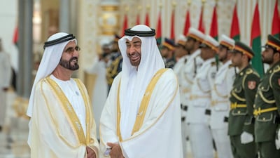 Sheikh Mohammed bin Rashid, Vice President and Ruler of Dubai, left, and Sheikh Mohamed bin Zayed, at a reception at the Presidential Palace. Hamad Al Kaabi / Ministry of Presidential Affairs