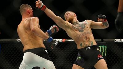Conor McGregor, right, lost his unbeaten record against Nate Diaz at UFC 196. Rey Del Rio / Getty Images