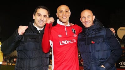 Joint Salford City owners Gary Neville and Nicky Butt celebrate victory with goalscorer Richie Allen night in their FA Cup win last month. Chris Brunskill / Getty Images / November 6, 2015