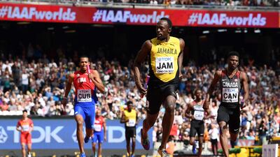 Usain Bolt crosses the finish line for Jamaica during the 4x100m relay heats at the World Championships in London on Saturday. Jewel Samad / AFP