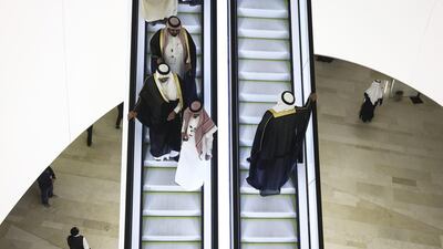 Guests ride an escalator during a tour of the King Abdulaziz Centre for World Culture in Dhahran, Saudi Arabia. Simon Dawson / Bloomberg