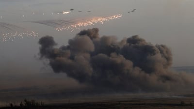 Planes drop bombs during Russias large-scale Center-2015 military exercises at Donguzsky Range. Sasha Mordovets / Getty Images