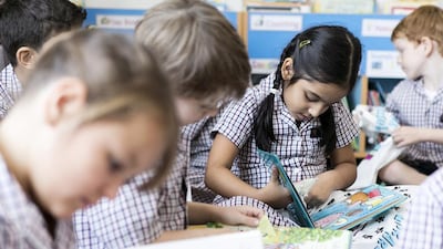Girls reading in the library at Dubai British School, one of many supporting the Reading Nation campaign. Reem Mohammed / The National