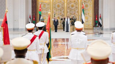 Sheikh Mohamed bin Zayed, Crown Prince of Abu Dhabi and Deputy Supreme Commander of the Armed Forces, and King Abdullah II of Jordan stand for the national anthem.