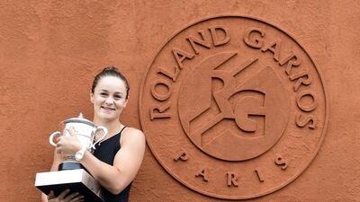 Austrlia's Ashleigh Barty poses with the French Open trophy. She defeated Marketa Vondrousova of the Czech Republic in Saturday's women's final at Roland Garros. EPA