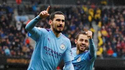 Manchester City's Ilkay Gundogan celebrates scoring with Bernardo Silva. The midfielder has set a stiff target for the coming season. Reuters