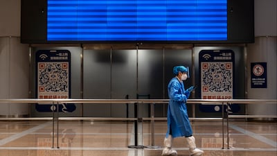 An empty screen displaying no flights in the international arrivals area of Beijing Capital International Airport. Getty Images