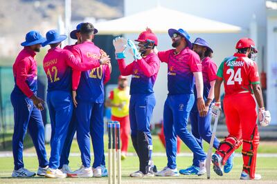 The UAE's players celebrate Dhruv Parashar's dismissal of Karan Sonavale. Photo: Oman Cricket
