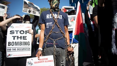 Some of the hundreds of protesters supporting the South African Boycott, Divestment and Sanctions movement demonstrate outside the Israel Trade Mission against recent attacks by Israel on the Gaza Strip, in Johannesburg. EPA