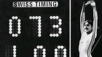 Nadia Comaneci, aged 14, jubilates when scoreboard shows the perfect score of 10 during the 1976 Olympic Games in Montreal, Canada.