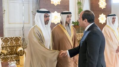 Sheikh Hamed bin Zayed, Chairman of the Crown Prince Court of Abu Dhabi and Abu Dhabi Executive Council Member (L), greets Abdel Fattah El Sisi, President of Egypt (R), during a reception at the Presidential Airport. Rashed Al Mansoori / Crown Prince Court - Abu Dhabi