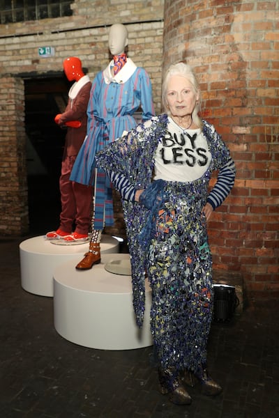 Vivienne Westwood wearing a 'Buy Less' top at the Archive Exhibition in Berlin 2017. Getty Images