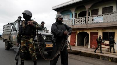 Soldiers from Cameroon's elite Rapid Intervention Battalion patrol the abandoned village of Elona near Buea on October 4, 2018. Reuters