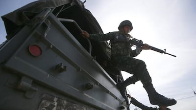 The crisis, the latest instalment of a near-decade-long power struggle between former telecoms tycoon Mr Thaksin and the royalist establishment, has brought the country to the brink of recession. Wason Wanichakorn / AP Photo