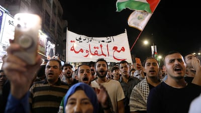 Demonstrators march in Amman on Sunday in support of the Allenby Bridge attacker. Reuters