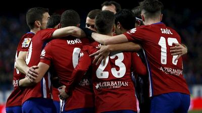 Atletico Madrid's players celebrate a goal during their La Liga win on Tuesday night. Juan Medina / Reuters / March 1, 2016