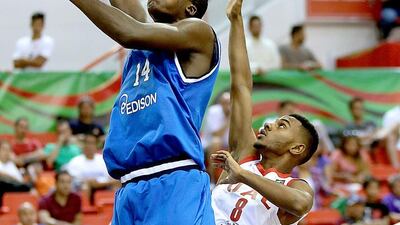 Nwohuocha Chinonso, left, of Italy and Suwais Salem of the UAE in action duirng the FIBA U17 World Championships at Al Ahli club in Dubai. Satish Kumar / The National