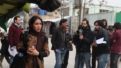 In a scene from a television drama, Afghan actress Leena Alam plays the title character in ‘Shereen's Law’, pictured here during filming on a street in Kabul. All photos: AFP