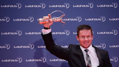 Mr Baumgartner with the Laureus World Action Sportsperson trophy in Rio de Janeiro, Brazil, in 2013. AP