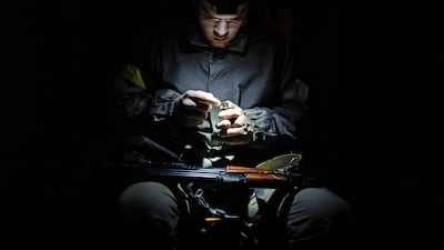 An armed member of the Territorial Defence Forces of Ukraine, as Russia's invasion of Ukraine continues, in Kyiv. Reuters