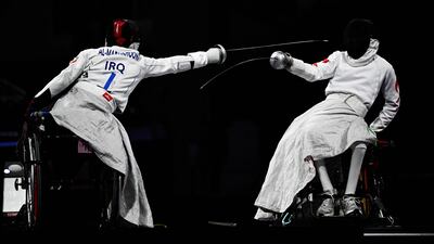 Iraq’s Zainulabdeen Al Madhkhoori competes against China’s Jie Zhang in the wheelchair fencing Men's Epee team final in Paris. AFP