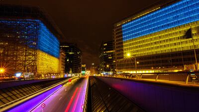 The EU Council, left, and EU Commission, right, buildings in Law Street, Brussels, Belgium, are illuminated in the colours of the flag of Ukraine to commemorate the anniversary of the Ukrainian war. EPA