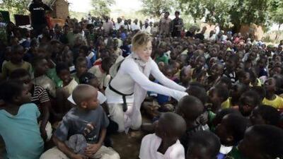 Madonna, shown with Malawian children at Mkoko Primary School in Kasungu, is said to be the largest private international donor to Malawi.