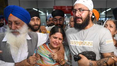 Afghan Sikhs arriving from Afghanistan at the airport in New Delhi, days after gunmen attacked a Sikh temple in Kabul. AFP