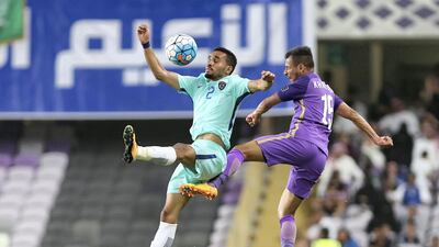 Al Ain's Khaled Abdulrahman and Al Hilal's Mohammed Ibrahim Alburayk in action during the first leg of their Asian Champions League quarter-final at Hazza bin Zayed Stadium. Chris Whiteoak / The National