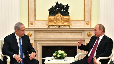 Russian President Vladimir Putin, right, speaks with Israeli Prime Minister Benjamin Netanyahu during their meeting at the Kremlin on July 11, 2018. EPA