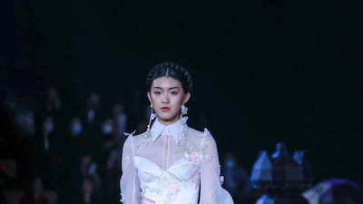 A model displays a creation from the Heaven Gaia collection by Xiong Ying. AFP