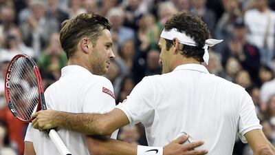 Marcus Willis shown with Roger Federer after his second round defeat at Wimbledon on Wednesday. Facundo Arrizabalaga / EPA / June 29, 2016