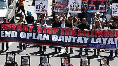 Rights activists protest in Manila against killings.