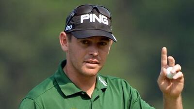 Louis Oosthuizen acknowledges the crowd after finishing his second round at the WGC HSBC Champions event