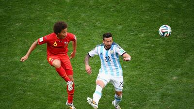 Axel Witsel of Belgium and Ezequiel Lavezzi of Argentina compete for the ball during their match on Saturday at the 2014 World Cup in Brasilia, Brazil. Jamie Squire / Getty Images