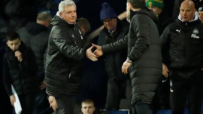 Newcastle United manager Steve Bruce shakes hands with West Bromwich Albion manager Slaven Bilic at the end of the match. Newcastle won 3-2 to advance to the FA Cup quarter-finals. Reuters