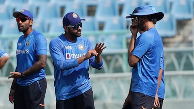 India's captain Rohit Sharma, second left, with head coach Rahul Dravid and batting coach Vikram Rathour, right, during a training session in Lucknow. AP