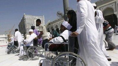 Pilgrims seated in wheelchairs circle the Kaaba and pray at the Grand Mosque during Tawaf al-Wadaa (Farewell Tawaf) on the last day of the Haj.