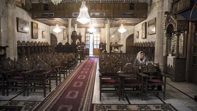 A member of Greek Orthodox Christian community arrives early for Sunday mass at the Church of Saint Porphyrius.